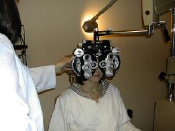 Optometrist determining eyeglasses prescription in the Yarmouth and Dennis, MA, area